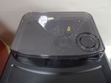 a plastic container with a lid on top of a stove