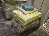 a stack of bags of toilet paper on a pallet