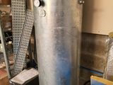 a large metal tank sitting in the middle of a room