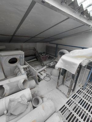 a room with a lot of pipes and pipes on the floor