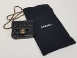 a black chanel bag and a black bag with a chain
