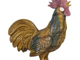 une figurine représentant un coq sur fond blanc