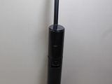 a black vacuum cleaner on the floor next to a white wall