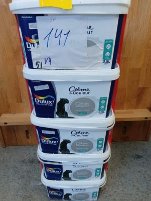 a stack of four containers with different types of paint