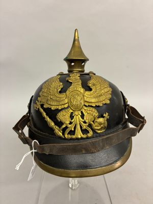 an old helmet with a golden eagle on it