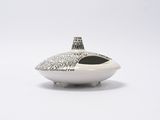 a white vase with a black and white design on it