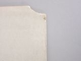 a piece of paper on a table with a clock on it