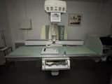 a medical room with a large machine in the middle of the room