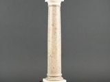 statue of a man standing on a column with a statue on top