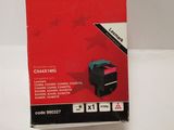 a black and red box of ink sitting on top of a white table