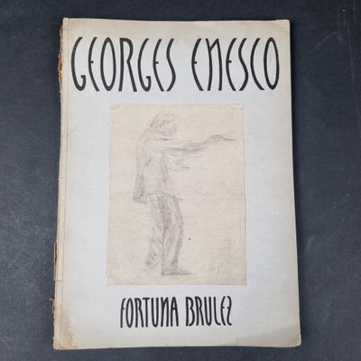 un vieux livre sur lequel figure le dessin d'un homme tenant un pistolet