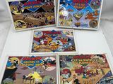 five cartoon books on a white table with a white background