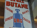 a sign that says legal butane on the side of a building