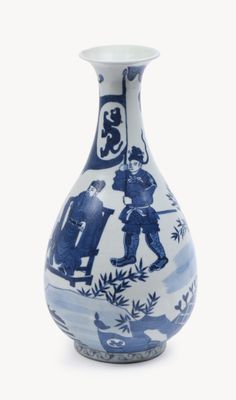 a blue and white vase with a picture of people on it