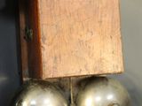 a metal object with a wooden box on top of it