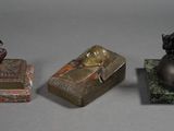 three different types of figurines sitting on top of a table