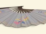 a white umbrella with a pink design on it