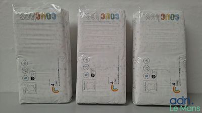 three white nintendo wii controllers sitting next to each other on a table