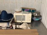 a microwave and a microwave oven sitting on a kitchen counter