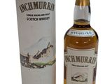 une photo d'une bouteille de whisky écossais à côté d'une boîte en carton