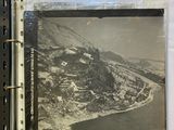 an old photo of a picture of a mountain and a river in a binder