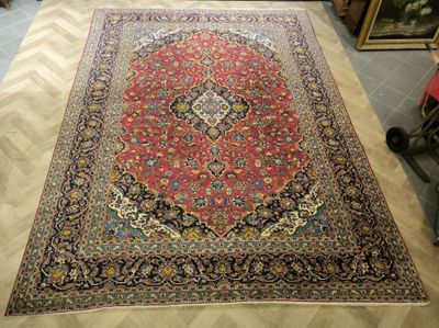an image of a large oriental rug on the floor in a room