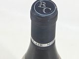 a bottle of wine that is sitting on a table