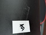 a close up of a boxing bag with a tag on it