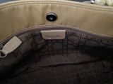 the inside of a purse with a tag on it
