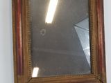 a mirror hanging on the wall in a room