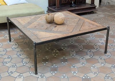 a coffee table with two coconuts on it in the middle of a room