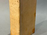 a small box with a piece of paper sticking out of it