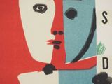 a poster with a woman ' s face on the front of it
