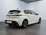 the rear view of a white car in a white room