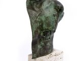statue of a male torso on a marble base on a white background
