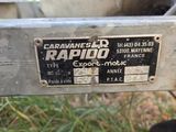 a close up of a lawn mower with a sign on it