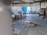 a room that has a refrigerator in it and a lot of boxes