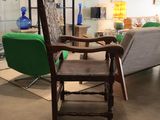 a chair that is sitting in the middle of a room
