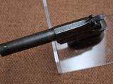 a gun that is sitting on top of a piece of plastic