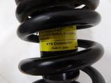 a close up of a coil with a yellow label on it