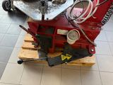 a machine that is sitting on a pallet in a room