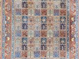 tapis persan ancien à motifs bleus et rouges