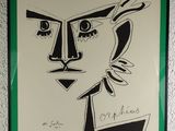painting of a woman ' s face in a green frame