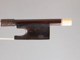 a bow that is attached to a string with a wooden handle
