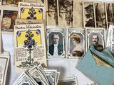 a table topped with lots of old postcards on it