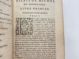 an open book with a black and white image of a man ' s face on it