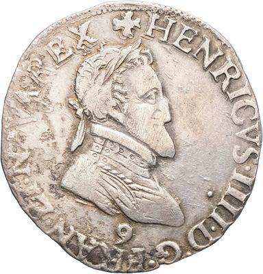 gros plan d'une pièce de monnaie sur laquelle figure une tête d'homme