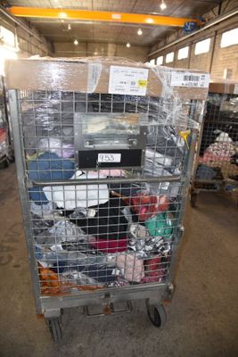 a metal cart with many items in it in a warehouse