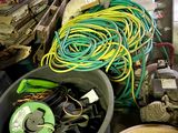 a pile of wires and other items in a room