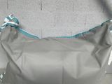 grey and teal handbag with white and blue trim